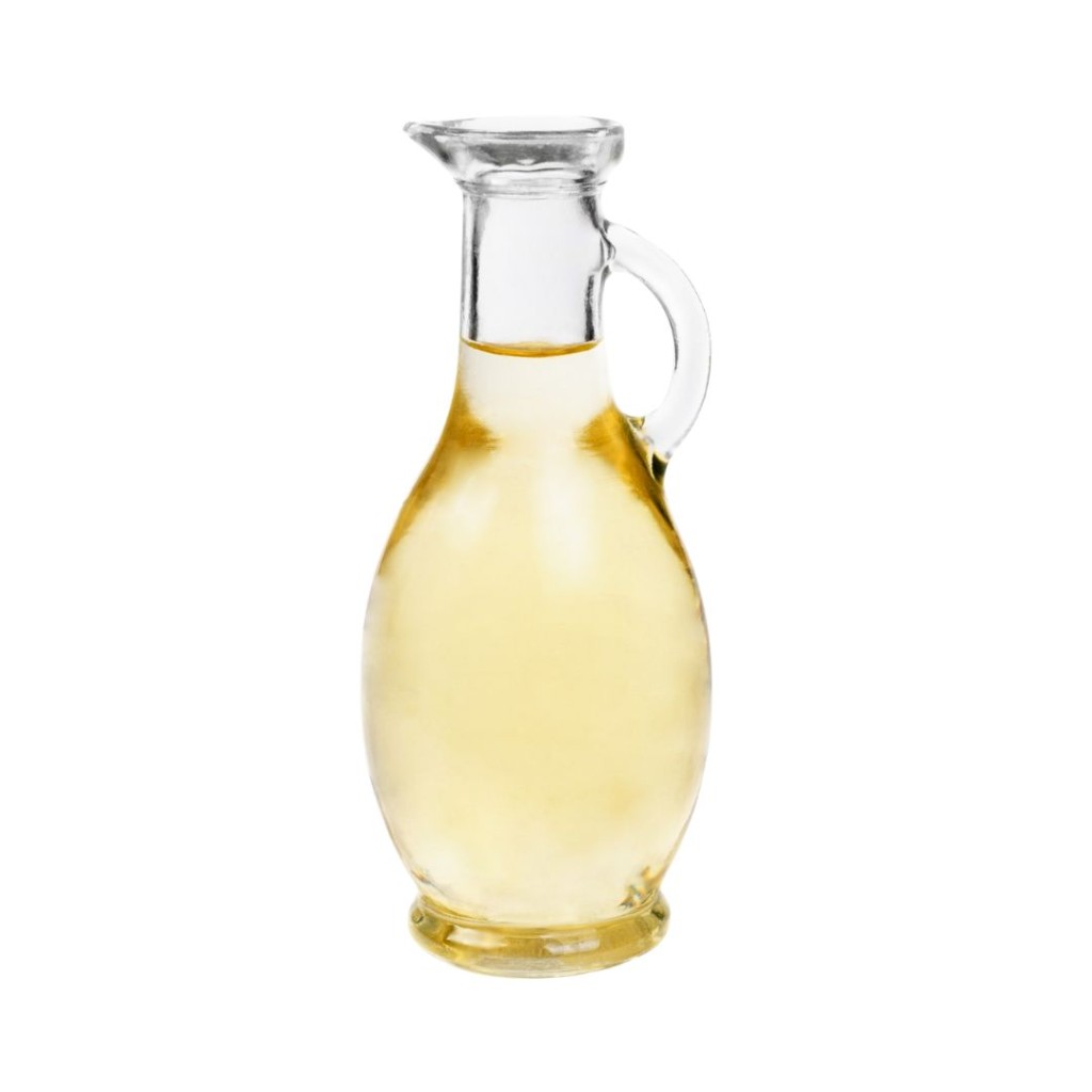 White Balsamic Vinegar in small jug on a white background